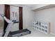 Home gym with treadmill and storage shelving at 2675 Timberchase Trl, Highlands Ranch, CO 80126