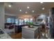 Open kitchen with large island and hardwood floors at 2675 Timberchase Trl, Highlands Ranch, CO 80126