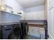 Laundry room with washer, dryer, and ample cabinetry at 2675 Timberchase Trl, Highlands Ranch, CO 80126