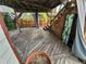 Backyard deck with curtained pergola, stairs, and ample space, creating a cozy outdoor retreat at 2758 S Salida St, Aurora, CO 80013