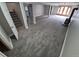 Basement features carpeted floor, a staircase, and a glass door to the outside at 2758 S Salida St, Aurora, CO 80013