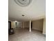 Unfinished basement featuring wood-burning stove, drop ceiling and tan flooring at 2758 S Salida St, Aurora, CO 80013