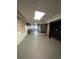 Unfinished basement with gray concrete flooring and drop ceiling at 2758 S Salida St, Aurora, CO 80013