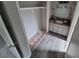 Bathroom featuring updated flooring, cabinets and sink with an open closet next to it at 2758 S Salida St, Aurora, CO 80013