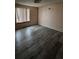 This bedroom features modern, gray wood flooring and neutral walls at 2758 S Salida St, Aurora, CO 80013