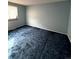 Bedroom with blue carpet and a window offering natural light at 2758 S Salida St, Aurora, CO 80013