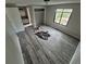 Open bedroom featuring new flooring, a window, closet and an open entryway to the kitchen at 2758 S Salida St, Aurora, CO 80013
