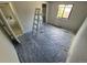 Bedroom with ladder and blue plastic covering the floor at 2758 S Salida St, Aurora, CO 80013