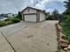 Spacious driveway leading to an attached garage, offering ample parking for multiple vehicles at 2758 S Salida St, Aurora, CO 80013