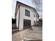 Angled view of home, showcasing a large wooden deck and sliding glass doors at 2758 S Salida St, Aurora, CO 80013