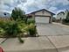 Charming single-Gathering home with stone accents, attached garage, and landscaped front yard at 2758 S Salida St, Aurora, CO 80013