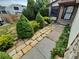 Charming front yard with stone pathway leading to a stone accented house at 2758 S Salida St, Aurora, CO 80013