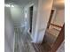 Hallway featuring wood-look floors leading to bedrooms, bathroom and stairs at 2758 S Salida St, Aurora, CO 80013