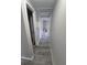 Hallway featuring wood-look floors leading to bedrooms and bathroom at 2758 S Salida St, Aurora, CO 80013