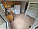 Well-lit kitchen with tiled floors, oak cabinets, and stainless steel appliances at 2758 S Salida St, Aurora, CO 80013