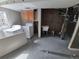Laundry room with washer, dryer, sink, and cabinets needing renovations and finishing at 2758 S Salida St, Aurora, CO 80013