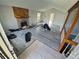 Spacious living room with a stone fireplace and light grey wood look flooring at 2758 S Salida St, Aurora, CO 80013