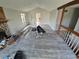 Bright living room with stone fireplace, and a staircase leading to the upper level at 2758 S Salida St, Aurora, CO 80013