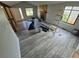This living room features a charming stone fireplace, ample natural light, and durable floors at 2758 S Salida St, Aurora, CO 80013