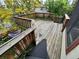 Spacious wooden upper deck featuring wooden railings, providing privacy and outdoor enjoyment at 2758 S Salida St, Aurora, CO 80013