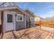 Exterior view of the house from the wood back deck area, enhanced for outdoor enjoyment at 1350 Valentia St, Denver, CO 80220