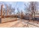 Back deck with wood finishings is perfect for Gathering cookouts and entertaining at 1350 Valentia St, Denver, CO 80220