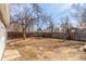 Spacious backyard with a sturdy wooden fence that ensures privacy and security at 1350 Valentia St, Denver, CO 80220