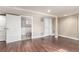 Basement featuring wood-look floors, recessed lighting, white doors, and access to the bathroom at 1350 Valentia St, Denver, CO 80220