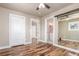 Serene bedroom with closet space and an en-suite bathroom with a vintage vanity at 1350 Valentia St, Denver, CO 80220