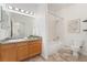 Well-maintained bathroom with vanity, ample lighting, and tub-shower combination at 16848 E Gunnison Dr # 9E, Aurora, CO 80017