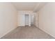 Empty bedroom with large closet and en-suite bathroom at 16848 E Gunnison Dr # 9E, Aurora, CO 80017