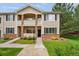 Charming two-story townhome with well-maintained landscaping, stone accents, and inviting front entry at 16848 E Gunnison Dr # 9E, Aurora, CO 80017