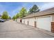 Row of garages with individual units, painted in neutral tones with brick accents, providing convenient parking at 16848 E Gunnison Dr # 9E, Aurora, CO 80017