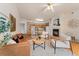 Inviting living room featuring a fireplace, stylish furniture, and an open layout to the kitchen and dining area at 16848 E Gunnison Dr # 9E, Aurora, CO 80017