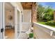 Private patio with stone accent pillar and views of green space at 16848 E Gunnison Dr # 9E, Aurora, CO 80017