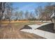 Large backyard with a tiered garden beds, retaining wall, and plenty of open space at 5145 S Clarkson St, Greenwood Village, CO 80121
