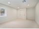 Spacious basement with a large window, closet, and neutral carpet perfect for storage at 5145 S Clarkson St, Greenwood Village, CO 80121
