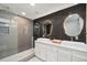 Modern bathroom with dual vanity sinks, a frameless glass shower, and stylish, modern backsplash at 5145 S Clarkson St, Greenwood Village, CO 80121