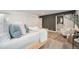 Cozy bedroom with modern decor featuring wood floors, lots of closet space, and access to en-suite bathroom at 5145 S Clarkson St, Greenwood Village, CO 80121