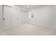 Bright bedroom featuring neutral carpet, minimalist decor and closet with sliding doors at 5145 S Clarkson St, Greenwood Village, CO 80121