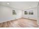 Bright bedroom featuring wood floors, white walls, and windows that let in natural light at 5145 S Clarkson St, Greenwood Village, CO 80121