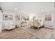 Bright bedroom with wood floors, accent chair, and large windows providing lots of natural light at 5145 S Clarkson St, Greenwood Village, CO 80121