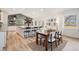 The dining area features wood floors, modern decor, and ample natural light from the sliding glass door at 5145 S Clarkson St, Greenwood Village, CO 80121