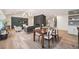 Open-concept living space showcasing a modern dining table and stylish furniture in a well-lit room at 5145 S Clarkson St, Greenwood Village, CO 80121