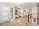 Stylish home entryway featuring wood-look tile, modern lighting, and chic decor, creating a welcoming ambiance at 5145 S Clarkson St, Greenwood Village, CO 80121