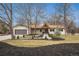 Charming single-story home featuring a tidy lawn, updated walkway, and modern garage at 5145 S Clarkson St, Greenwood Village, CO 80121