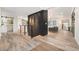 Hallway with black accent wall, modern banister and open access to the stylish living spaces at 5145 S Clarkson St, Greenwood Village, CO 80121