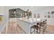 Bright kitchen features an oversized island with marble countertop, stylish decor, and views to backyard at 5145 S Clarkson St, Greenwood Village, CO 80121