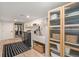A modern laundry room with ample storage, folding counter, dog wash station and new machines at 5145 S Clarkson St, Greenwood Village, CO 80121