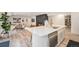 Open-concept living space with a kitchen island, modern fireplace, and comfortable seating at 5145 S Clarkson St, Greenwood Village, CO 80121
